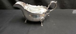 A Very Elegant Antique Silver Plated Sauce Boat By Walker And Hall Of Sheffield.
