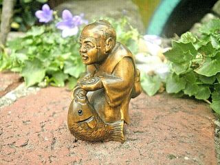 Hand Carved Wood Netsuke Fisherman With Fish And Club Collectable Figure.  1