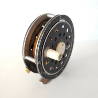 Vintage Fly Fishing Reel,  Black Silver Trim,  Foot Marked Japan,  3 5/8 " Diameter