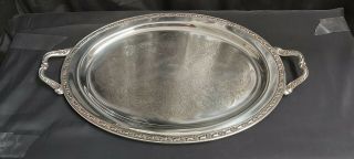 A Large Antique Silver Plated Serving Tray With Elegant Patterns.