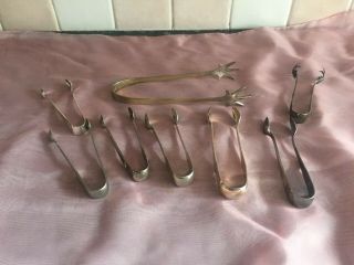A Selection Of 8 Silver Plated Sugar Tongs