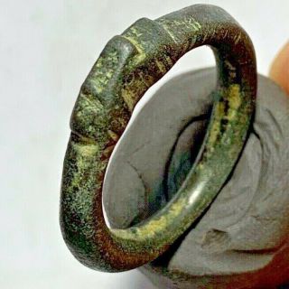 ANCIENT CELTIC BRONZE RING IN THE FORM OF A COILED (HEAD SNAKE) CIRCA ...