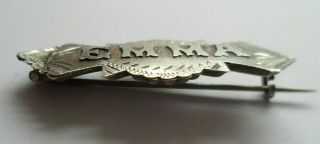 Antique silver brooch with the name ' EMMA ' in silver on the front. 2