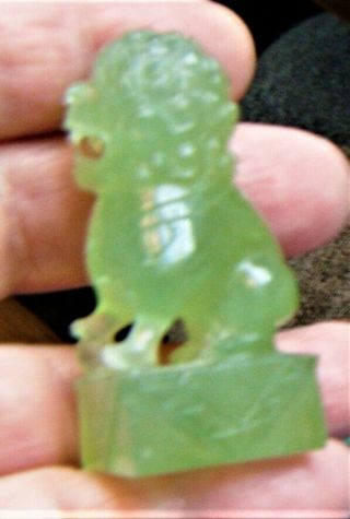 A Japanese/Chinese jade carving of a shishi on an oblong base 3