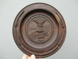 An Antique Black Forest Carved Wood Bread Board Plate.