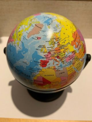 A Swivel And Tilt Mini Globe By Atlas Guides