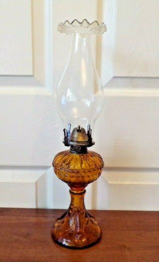 A Very Pretty Vintage Amber Glass Oil Lamp With Sea Serpent Design Order