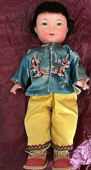 Antique Chinese Composition Doll In Silk Clothing.