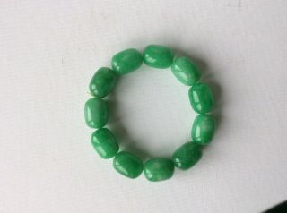 A Contemporary Chinese Apple Green Jade/hardstone Bracelet.