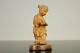 A Chinese carved wood figure of a child with a book mark to base 20thc 3