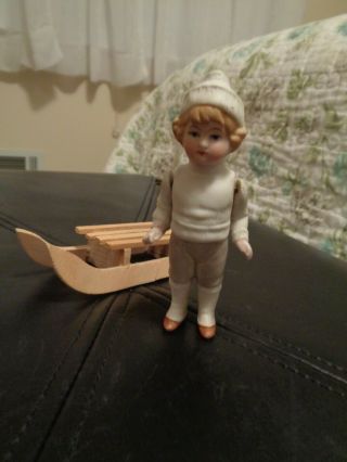 Antique All - Bisque German Dollhouse Boy Doll with Molded Clothes,  Wooden Sled 2