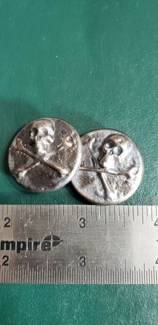 1.  00 Ozt Hand Poured.  999 Silver.  Antiqued Skull Coin