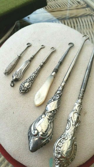5 Various Silver Button Hooks,  1