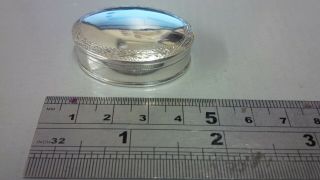 As Silver And 925 Stamped Oval Pill Box With Engraved Edge.