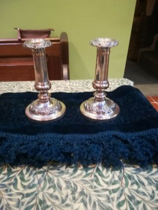 A 7 Inch Silver Plate On Copper Candlesticks