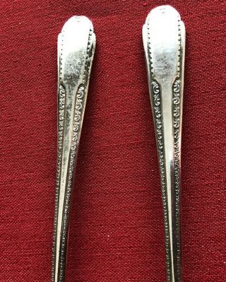 Two Antique Iced Tea Spoons,  marked Cavalier Silver Plate,  7.  5 in 2