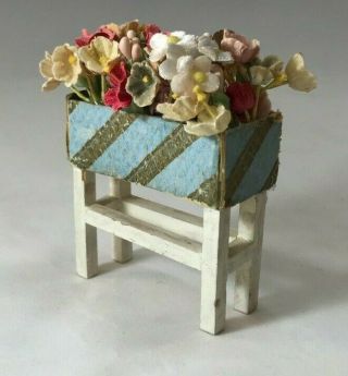 Vintage Plant Stand with Blue and Gold Embossed Paper Planter and Cloth Flowers 3
