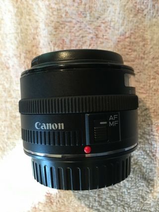 Canon EF 35 mm f/2.  0 IS UMS Wide Angle Lens,  hood cover.  Rarely. 3